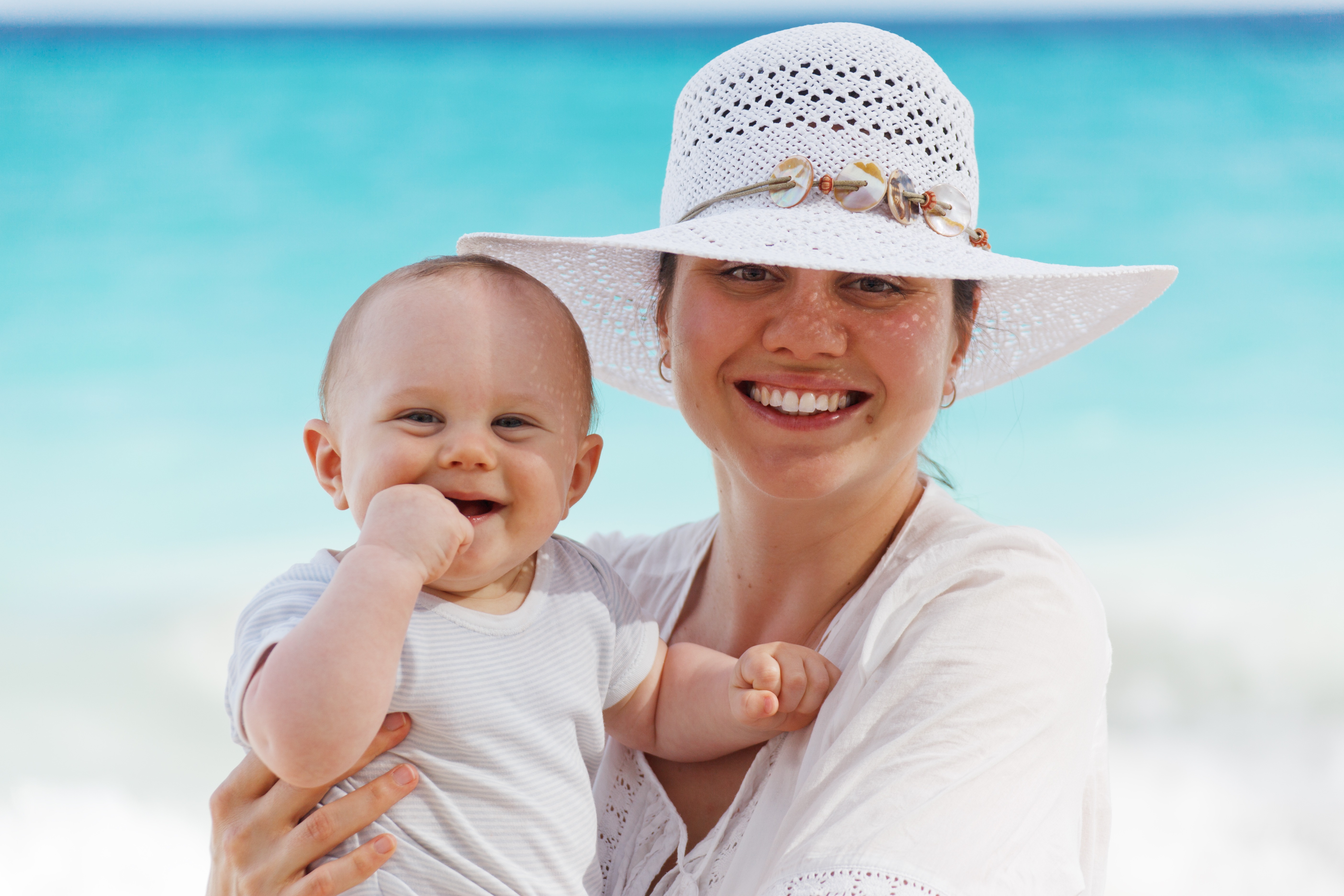 Cute Baby and Mother Smiling Together Wallpaper